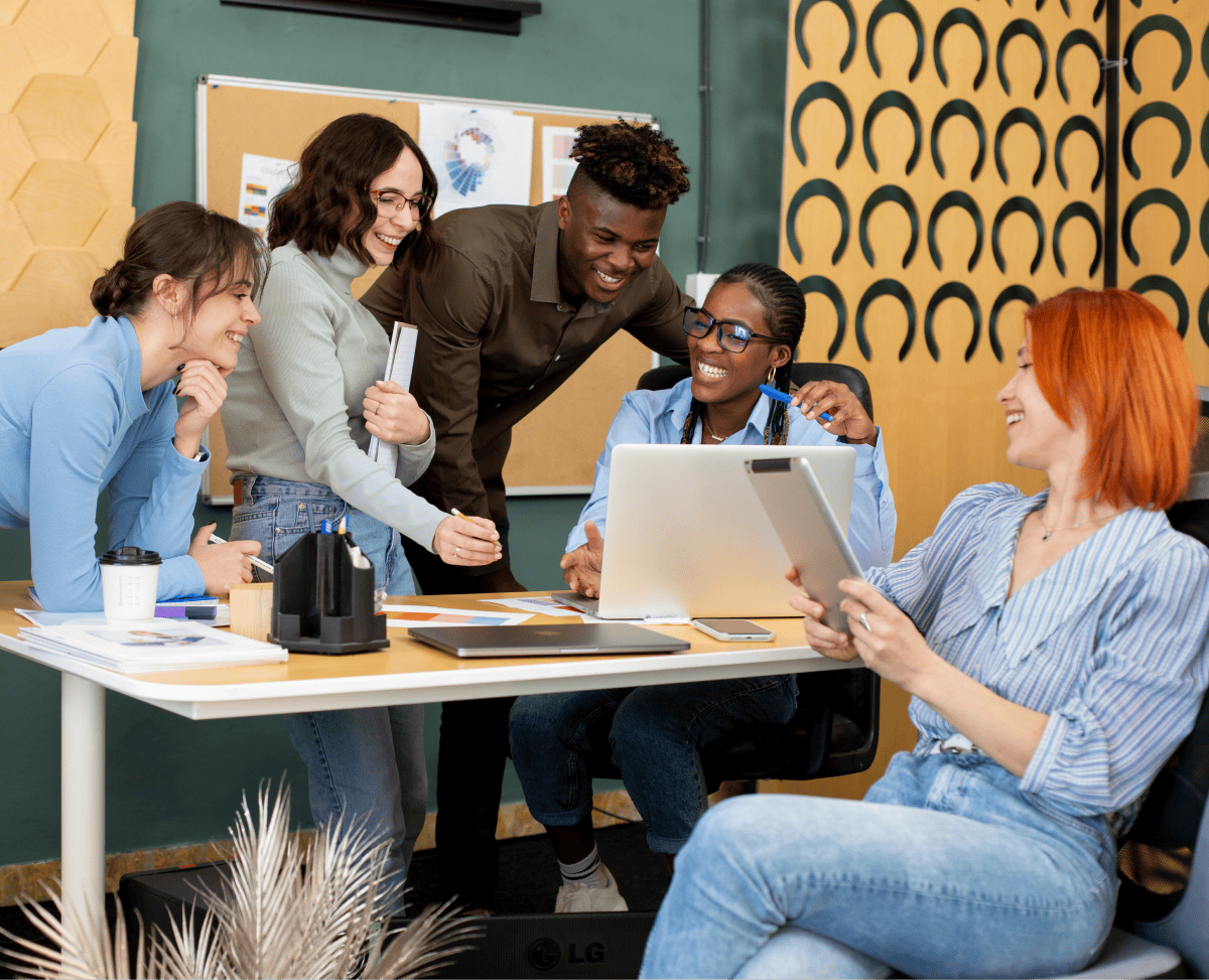 Home 1 Diverse team collaborating on digital business strategies in a modern office.