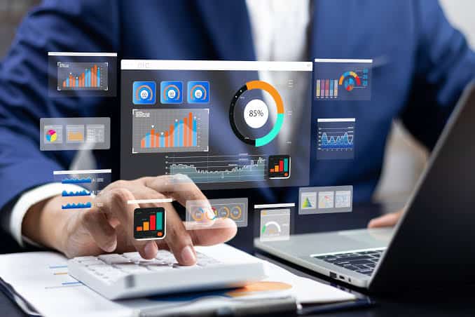 Tech & Startup Marketing 1 Business professional analyzing digital data and charts on transparent screen.